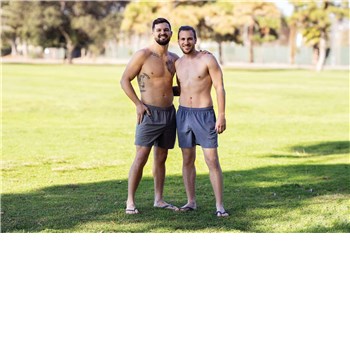 Two topless males posed caressing