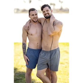 Two topless males posed caressing