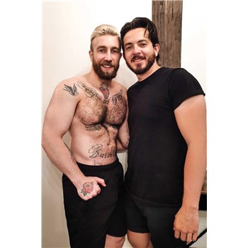 Topless male posed with clothed male