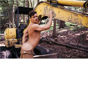 Topless male posed in outdoor setting displaying rear