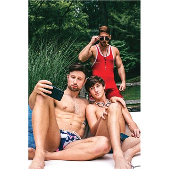 Two topless males caressing seated caressing taking selfie with male onlooker