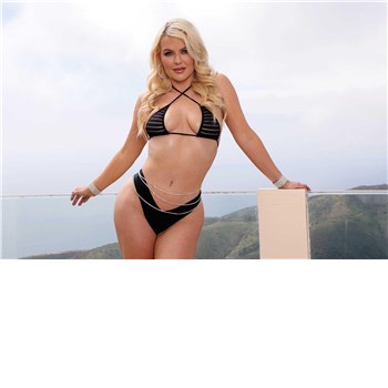 Blonde female posed wearing swimsuit displaying cleavage