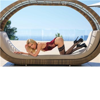 blonde female in doggie position wearing lingerie in outdoor recliner