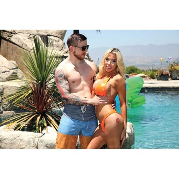 Blonde TS female wearing bikini pose with topless male