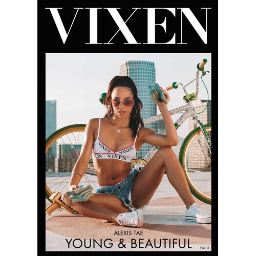 Brunette female posed seated wearing bikini top and shorts displaying cleavage vixen