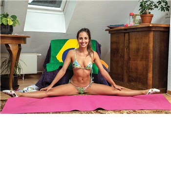 Brunette female posed in yoga position wearing lingerie displaying cleavage