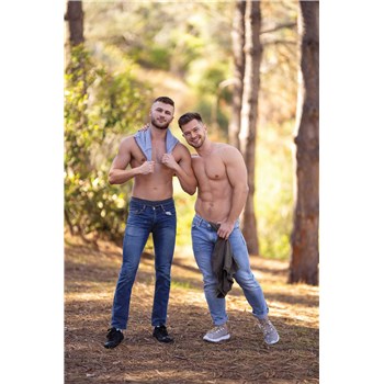 Two topless males posed out doors