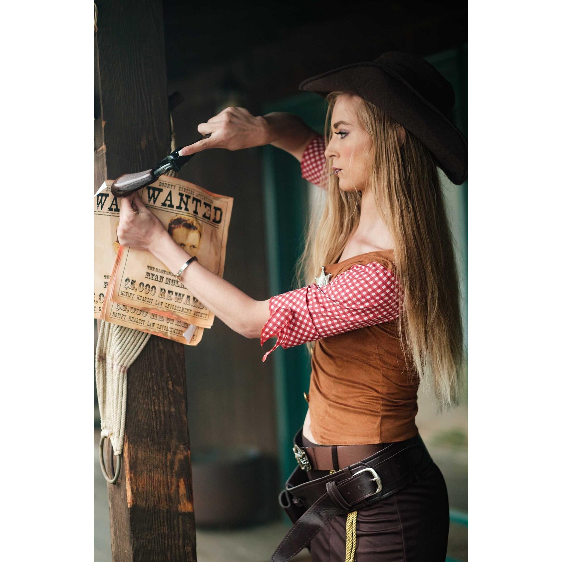 Blonde female in cow girl attire