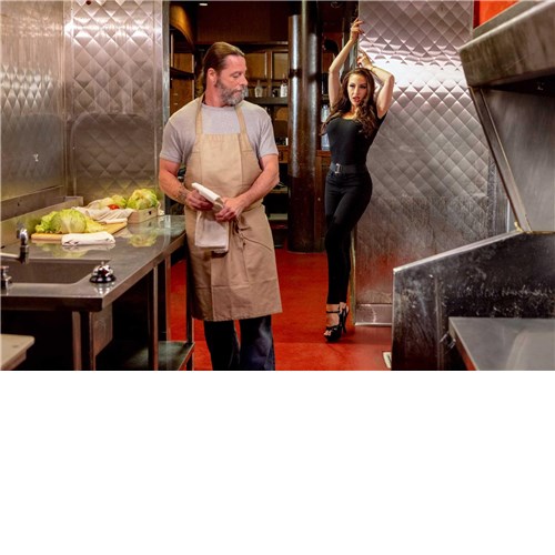 Male with brunette female in kitchen