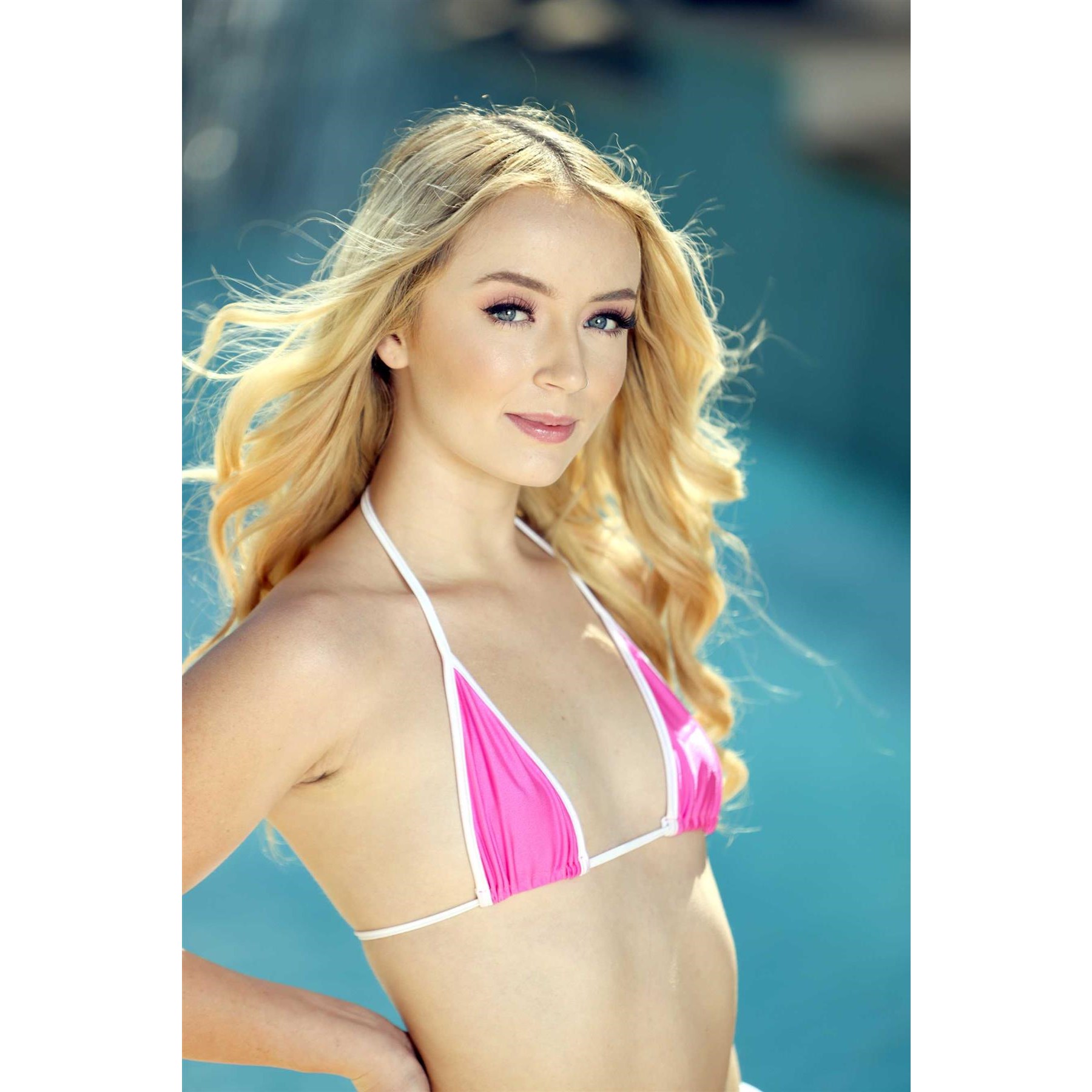 Blonde femlae wearing bikini top displaying cleavage