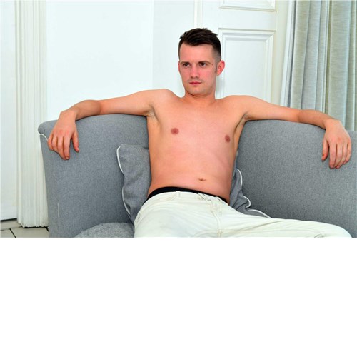 Seated male posed topless