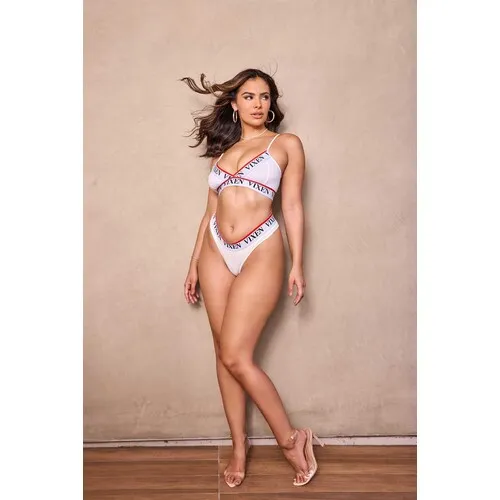 Brunette female posed wearing lingerie displaying cleavage